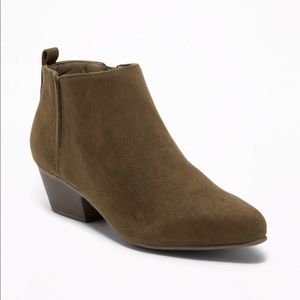 Olive colored ankle length suede boots.